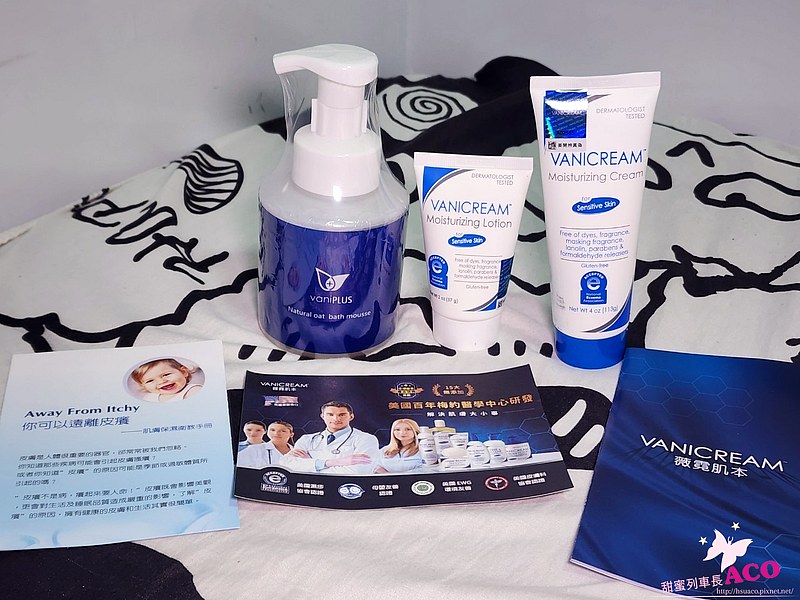 這張照片展示了 VANICREAM 和 vaniPLUS 的護膚產品，包含薇霓肌本全日高效修護保濕乳霜、無油安膚清爽調理乳液旅行瓶、天然燕麥潔膚慕斯以及一些相關的宣傳資料。
